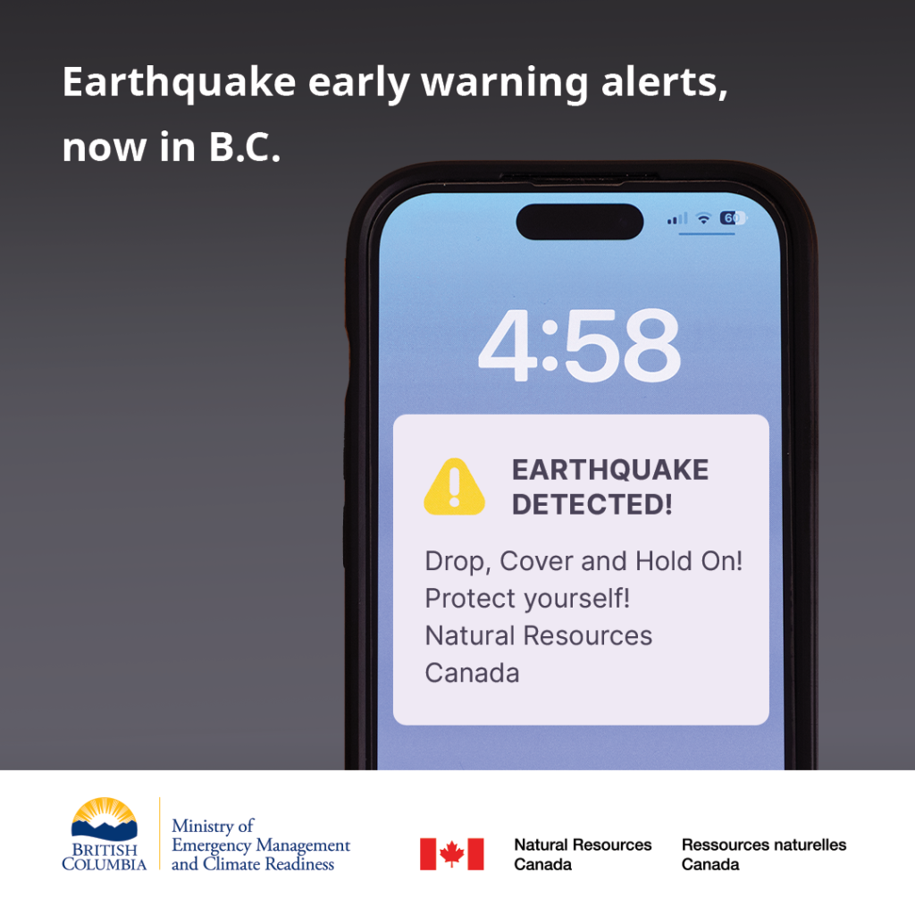 A photo of a mobile phone displaying an earthquake alert