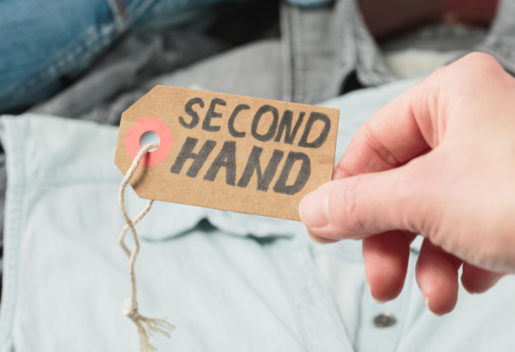 Person purchasing second hand clothes