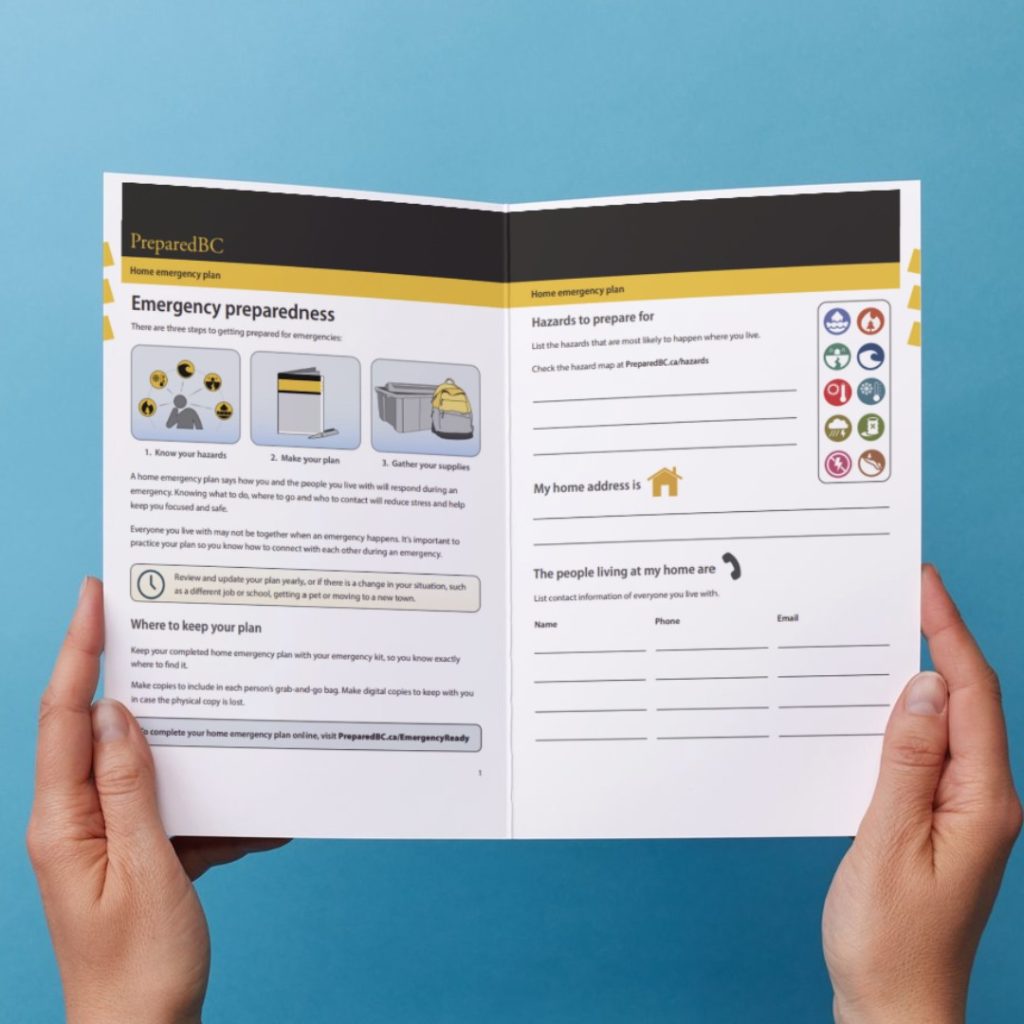 Hands holding up the PreparedBC Home Emergency Plan which is opened to a page titled "Emergency preparedness" with space to list hazards to prepare for, home address and contact information for people living in your home.