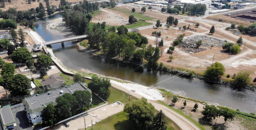 Completed flood mitigation works for downtown Grand Forks (City Park in foreground), North Ruckle Dike and Floodplain Naturalization in background. (August 2024)